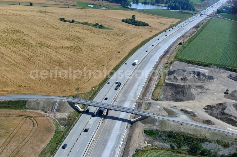 Aerial photograph Pörmitz - Buildings and route of the motorway A9 motorway with four lanes now. Currently, reconstruction, expansion and new construction work is underway for the six-lane expansion of Highway 9 near Poermitz by Wayss & Freytag Ingenieurbau and EUROVIA VINCI in Thuringia