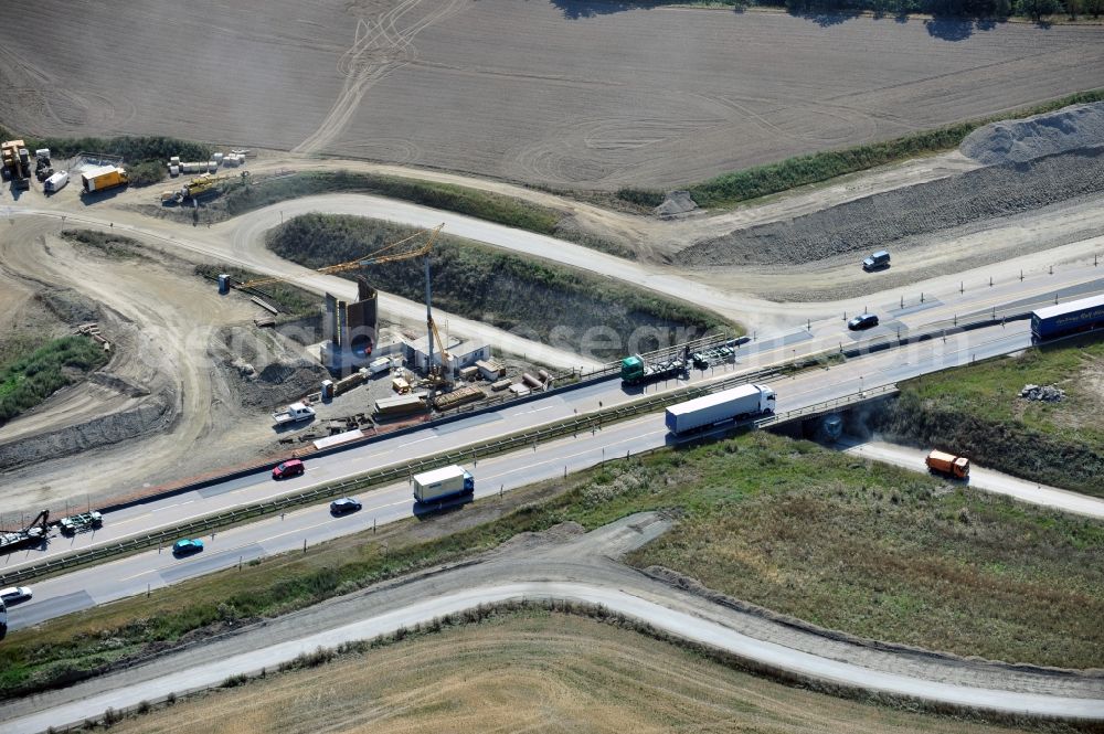 Schleiz from the bird's eye view: Buildings and route of the motorway A9 motorway with four lanes now. Currently, reconstruction, expansion and new construction work is underway for the six-lane expansion of Highway 9 between Triptis and Schleiz by Wayss & Freytag Ingenieurbau and EUROVIA VINCI in Thuringia