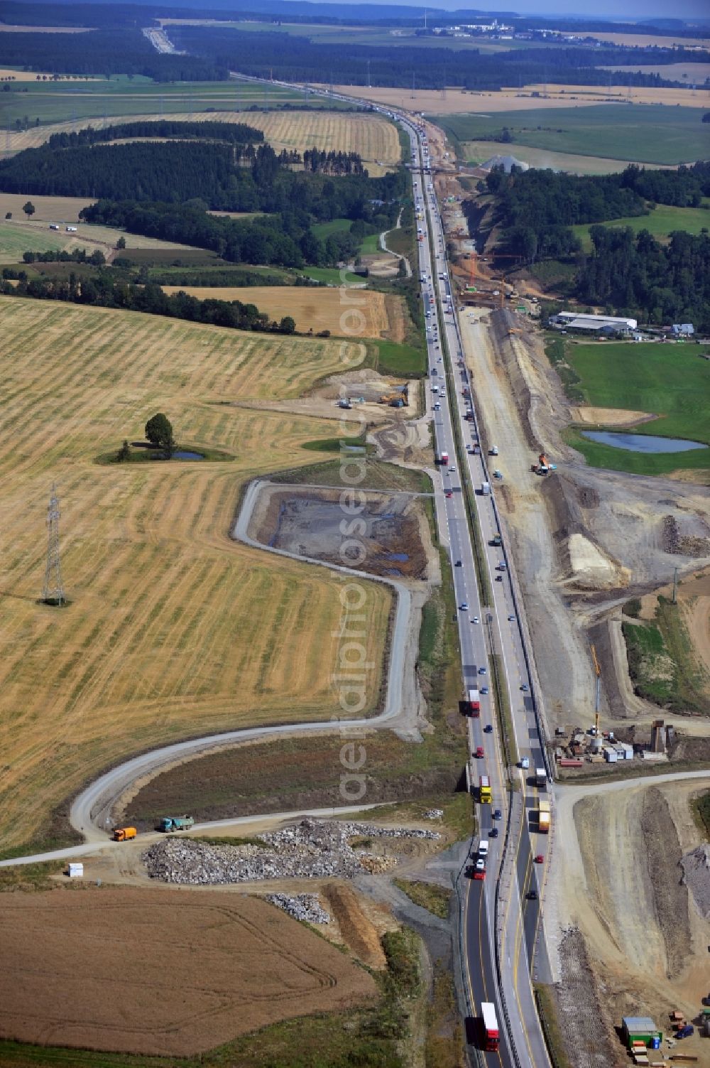 Schleiz from above - Buildings and route of the motorway A9 motorway with four lanes now. Currently, reconstruction, expansion and new construction work is underway for the six-lane expansion of Highway 9 between Triptis and Schleiz by Wayss & Freytag Ingenieurbau and EUROVIA VINCI in Thuringia