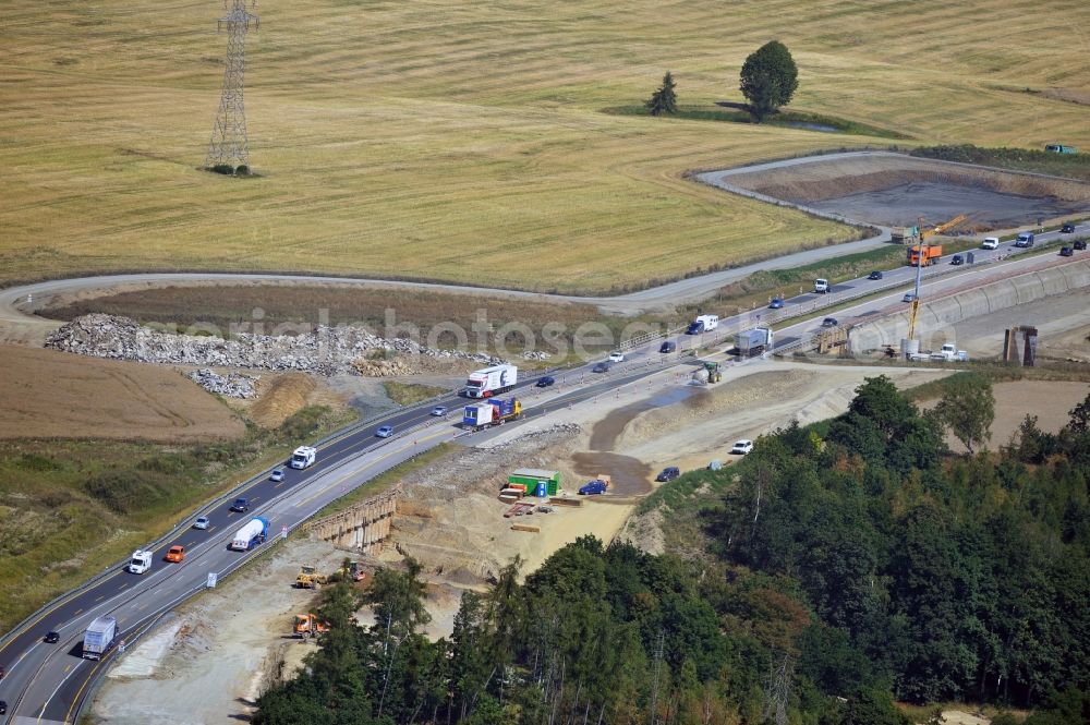 Schleiz from above - Buildings and route of the motorway A9 motorway with four lanes now. Currently, reconstruction, expansion and new construction work is underway for the six-lane expansion of Highway 9 between Triptis and Schleiz by Wayss & Freytag Ingenieurbau and EUROVIA VINCI in Thuringia