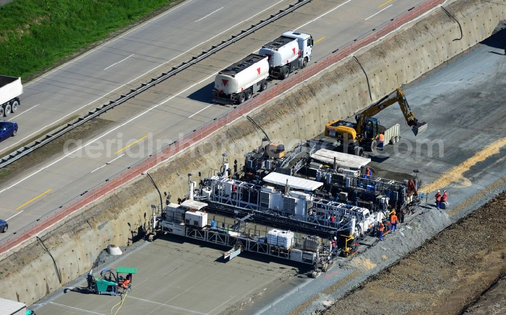 Aerial photograph Schleiz - Buildings and route of the motorway A9 motorway with four lanes now. Currently, reconstruction, expansion and new construction work is underway for the six-lane expansion of Highway 9 between Triptis and Schleiz by Wayss & Freytag Ingenieurbau and EUROVIA VINCI in Thuringia