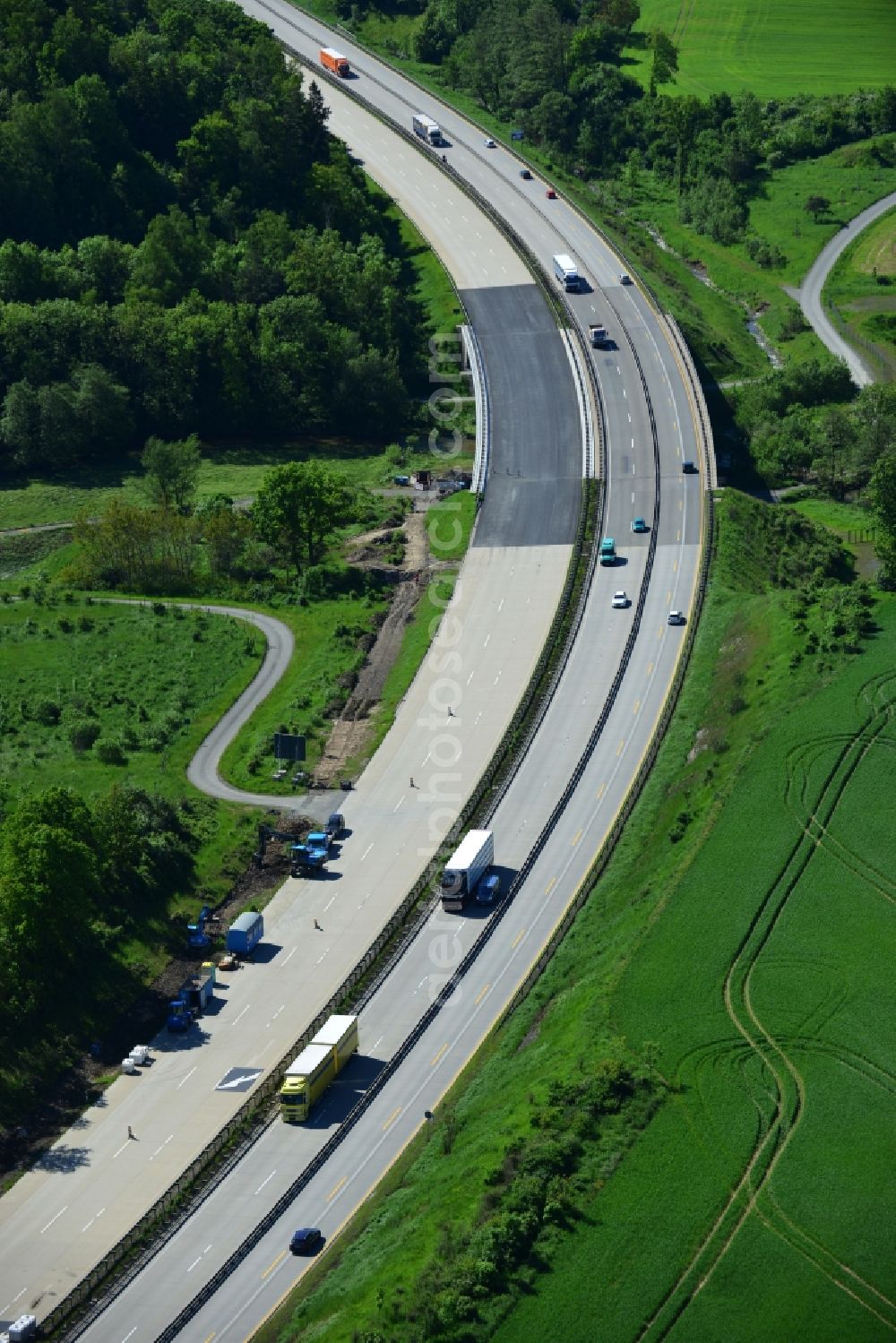 Schleiz from above - Buildings and route of the motorway A9 motorway with four lanes now. Currently, reconstruction, expansion and new construction work is underway for the six-lane expansion of Highway 9 between Triptis and Schleiz by Wayss & Freytag Ingenieurbau and EUROVIA VINCI in Thuringia