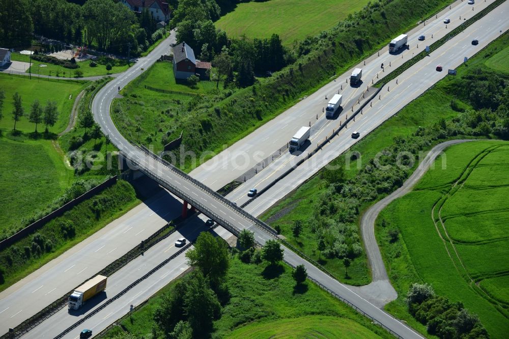 Aerial photograph Schleiz - Buildings and route of the motorway A9 motorway with four lanes now. Currently, reconstruction, expansion and new construction work is underway for the six-lane expansion of Highway 9 between Triptis and Schleiz by Wayss & Freytag Ingenieurbau and EUROVIA VINCI in Thuringia