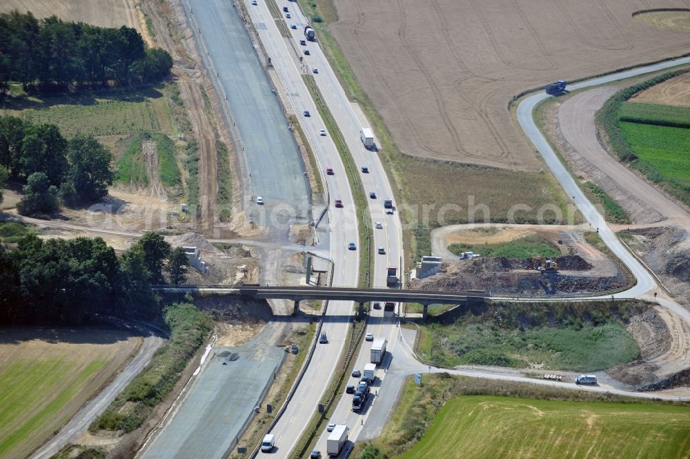 Aerial photograph Triptis - Buildings and route of the motorway A9 motorway with four lanes now. Currently, reconstruction, expansion and new construction work is underway for the six-lane expansion of Highway 9 between Triptis and Schleiz by Wayss & Freytag Ingenieurbau and EUROVIA VINCI in Thuringia