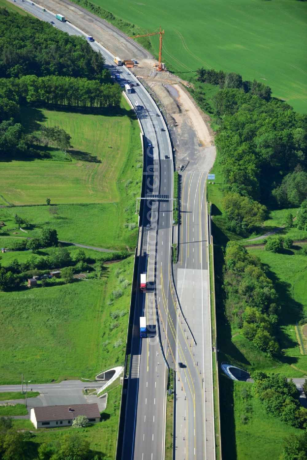 Aerial image Triptis - Buildings and route of the motorway A9 motorway with four lanes now. Currently, reconstruction, expansion and new construction work is underway for the six-lane expansion of Highway 9 between Triptis and Schleiz by Wayss & Freytag Ingenieurbau and EUROVIA VINCI in Thuringia