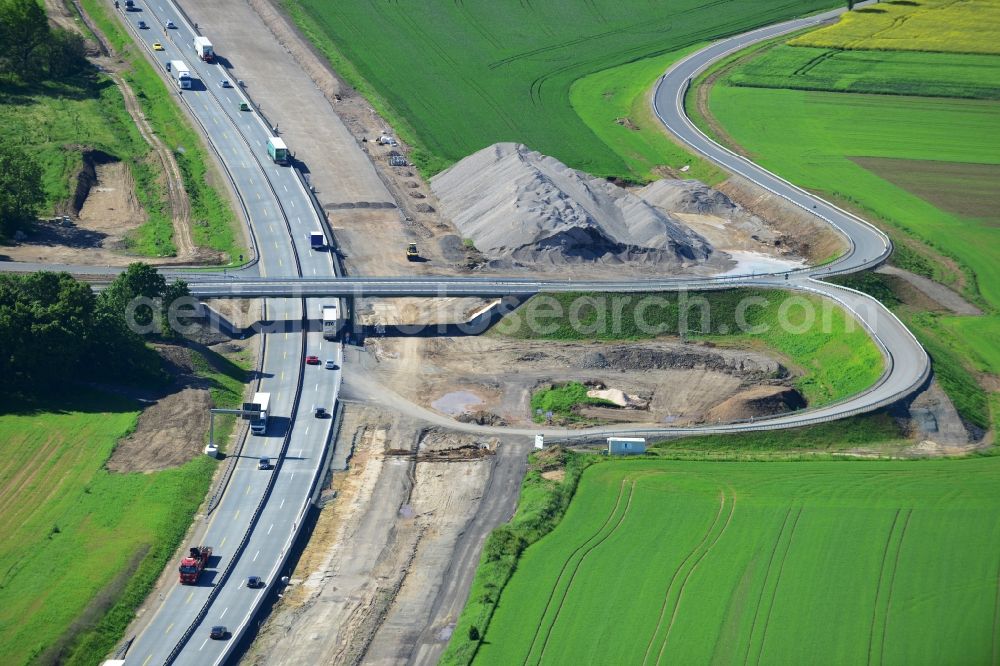 Aerial photograph Triptis - Buildings and route of the motorway A9 motorway with four lanes now. Currently, reconstruction, expansion and new construction work is underway for the six-lane expansion of Highway 9 between Triptis and Schleiz by Wayss & Freytag Ingenieurbau and EUROVIA VINCI in Thuringia