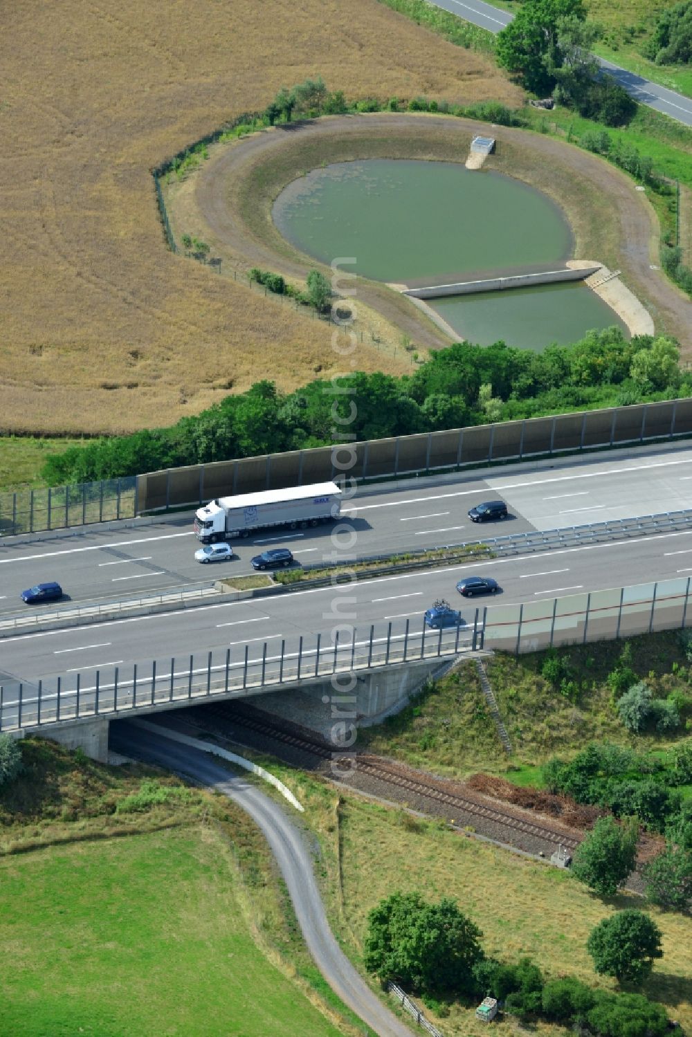 Triptis from the bird's eye view: Buildings and route of the motorway A9 motorway with four lanes now. Currently, reconstruction, expansion and new construction work is underway for the six-lane expansion of Highway 9 between Triptis and Schleiz by Wayss & Freytag Ingenieurbau and EUROVIA VINCI in Thuringia