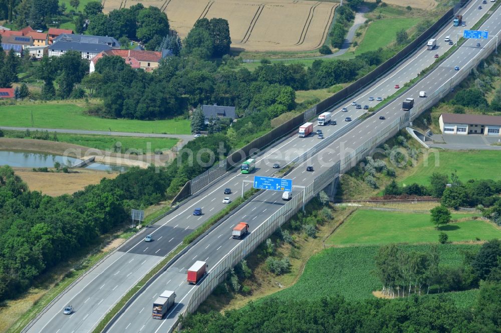 Triptis from above - Buildings and route of the motorway A9 motorway with four lanes now. Currently, reconstruction, expansion and new construction work is underway for the six-lane expansion of Highway 9 between Triptis and Schleiz by Wayss & Freytag Ingenieurbau and EUROVIA VINCI in Thuringia