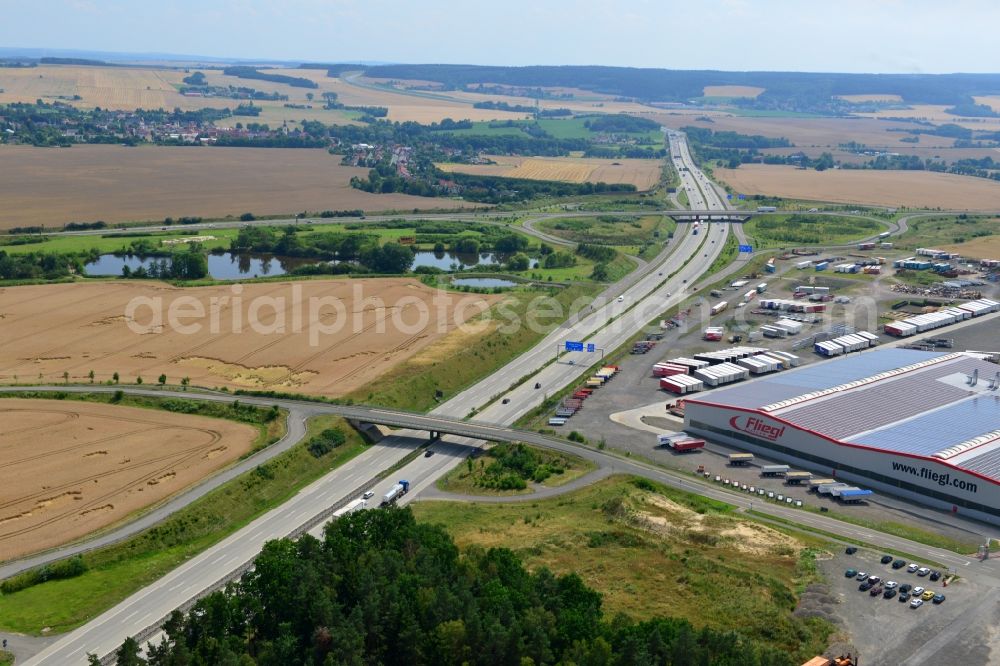 Aerial photograph Triptis - Buildings and route of the motorway A9 motorway with four lanes now. Currently, reconstruction, expansion and new construction work is underway for the six-lane expansion of Highway 9 between Triptis and Schleiz by Wayss & Freytag Ingenieurbau and EUROVIA VINCI in Thuringia