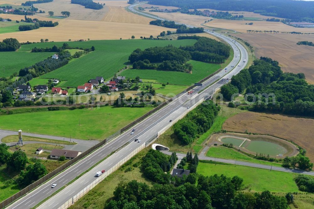 Triptis from the bird's eye view: Buildings and route of the motorway A9 motorway with four lanes now. Currently, reconstruction, expansion and new construction work is underway for the six-lane expansion of Highway 9 between Triptis and Schleiz by Wayss & Freytag Ingenieurbau and EUROVIA VINCI in Thuringia