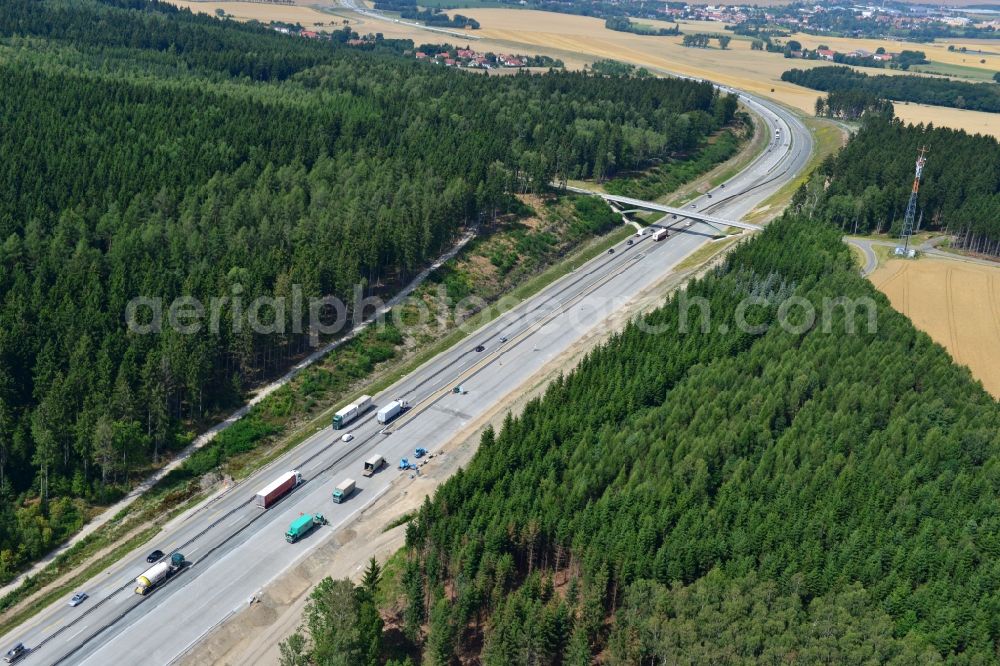 Wüstenwetzdorf from the bird's eye view: Buildings and route of the motorway A9 motorway with four lanes now. Currently, reconstruction, expansion and new construction work is underway for the six-lane expansion of Highway 9 between Triptis and Schleiz by Wayss & Freytag Ingenieurbau and EUROVIA VINCI in Thuringia