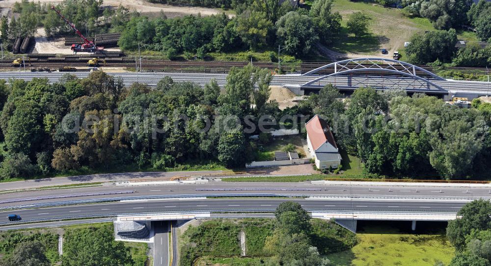 Dessau-Roßlau from the bird's eye view: Blick auf verschiedene Brückenbauwerke an der Baustelle zum Ausbau der B184 zwischen Dessau und Roßlau in Sachsen-Anhalt. Die B184 wird aufgrund des gestiegenen Verkehrsaufkommens zwischen 2006 und 2009 als vierstreifige Bundesstraße (RQ 20) über den Verlauf der Elbe hinweg ausgebaut. Bauherr ist der Landesbetrieb Bau Sachsen-Anhalt, die Projektleitung liegt bei SCHÜßLER - PLAN Berlin.View of different bridge structures on the site for the expansion of the B184 between Dessau and Roßlau in Saxony-Anhalt.