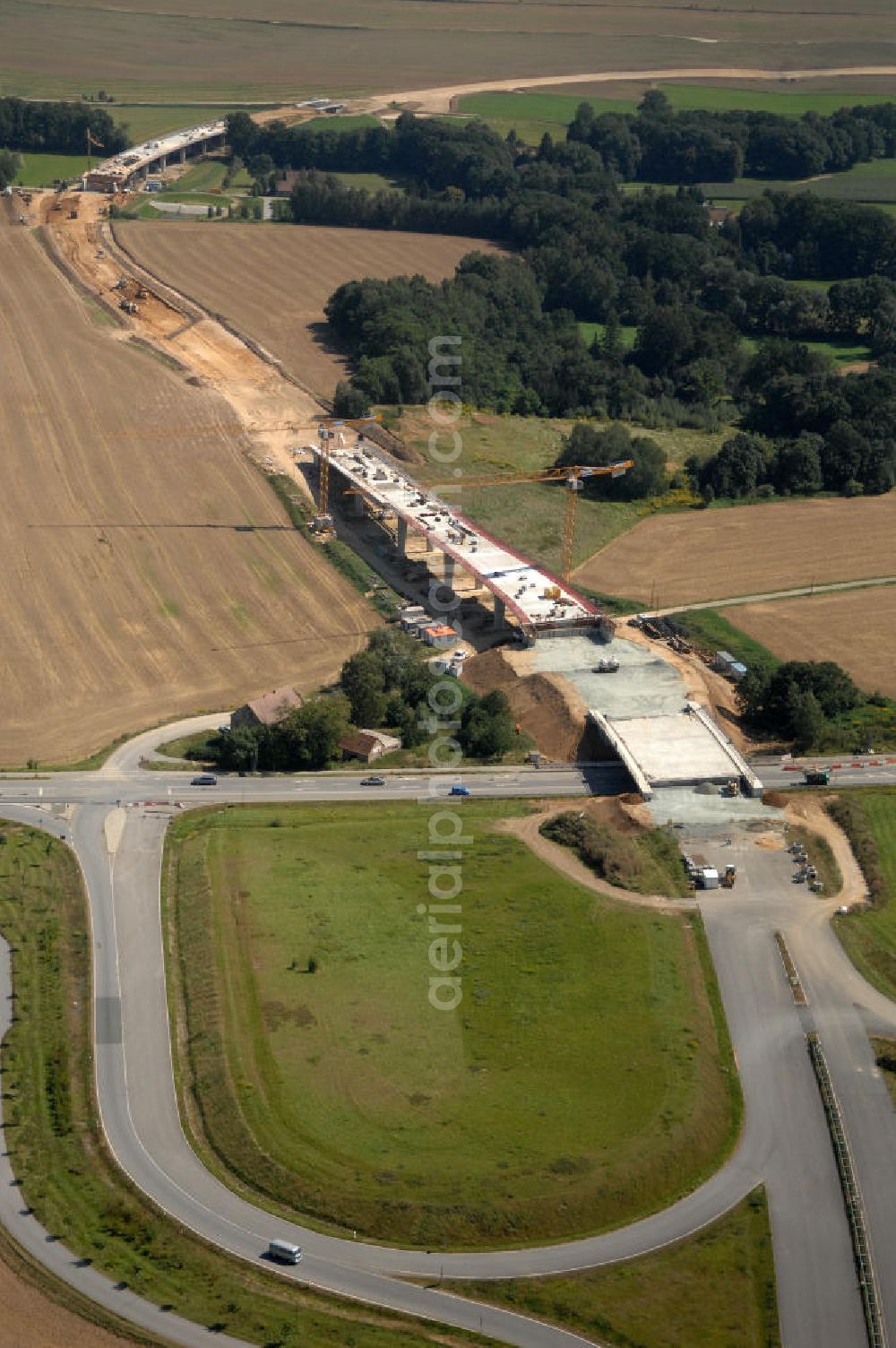 Aerial photograph Löbau - Blick auf den Ausbau der B 178 an der Ortsumfahrung Löbau im Landkreis Görlitz in Sachsen. Im Zuge des Bauvorhabens B 178 Neuverlegung zwischen der BAB A 4 und der Bundesgrenze D / PL errichtet die Hentschke Bau GmbH die Neubaustrecke der B 178. Kontakt: Hentschke Bau GmbH, Tel. +49 (0) 359 167 030,