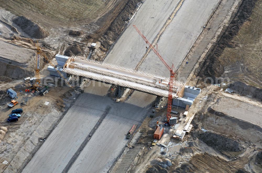 Aerial photograph Schönefeld - Blick auf den Ausbau der A113n als südöstliches Tor zur Hauptstadt. Unter Berücksichtigung des Flughafen Berlin Brandenburg International wurde eine Verkehrskonzeption für den Ausbau des Straßennetzes im Raum Berlin-Schönefeld erarbeitet, die zwei Stufen umfasste. Die erste Stufe sah den vierstreifigen Ausbau der Bundesstraßen B 96a und B 179 mit der Anbindung des Flughafens über zwei Knotenpunkte vor. Inhalt der zweiten Stufe war der Anschluß der Bundesautobahn A 113 neu an die B 9?????????????????????????????????????????????????????????????????