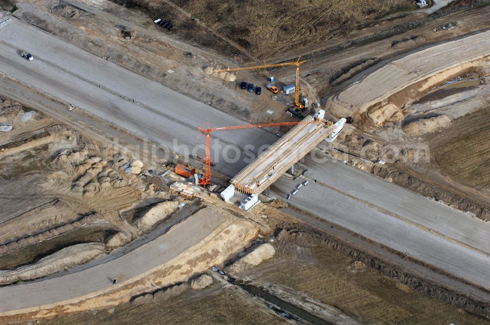 Schönefeld from the bird's eye view: Blick auf den Ausbau der A113n als südöstliches Tor zur Hauptstadt. Unter Berücksichtigung des Flughafen Berlin Brandenburg International wurde eine Verkehrskonzeption für den Ausbau des Straßennetzes im Raum Berlin-Schönefeld erarbeitet, die zwei Stufen umfasste. Die erste Stufe sah den vierstreifigen Ausbau der Bundesstraßen B 96a und B 179 mit der Anbindung des Flughafens über zwei Knotenpunkte vor. Inhalt der zweiten Stufe war der Anschluß der Bundesautobahn A 113 neu an die B 9?????????????????????????????????????????????????????????????????