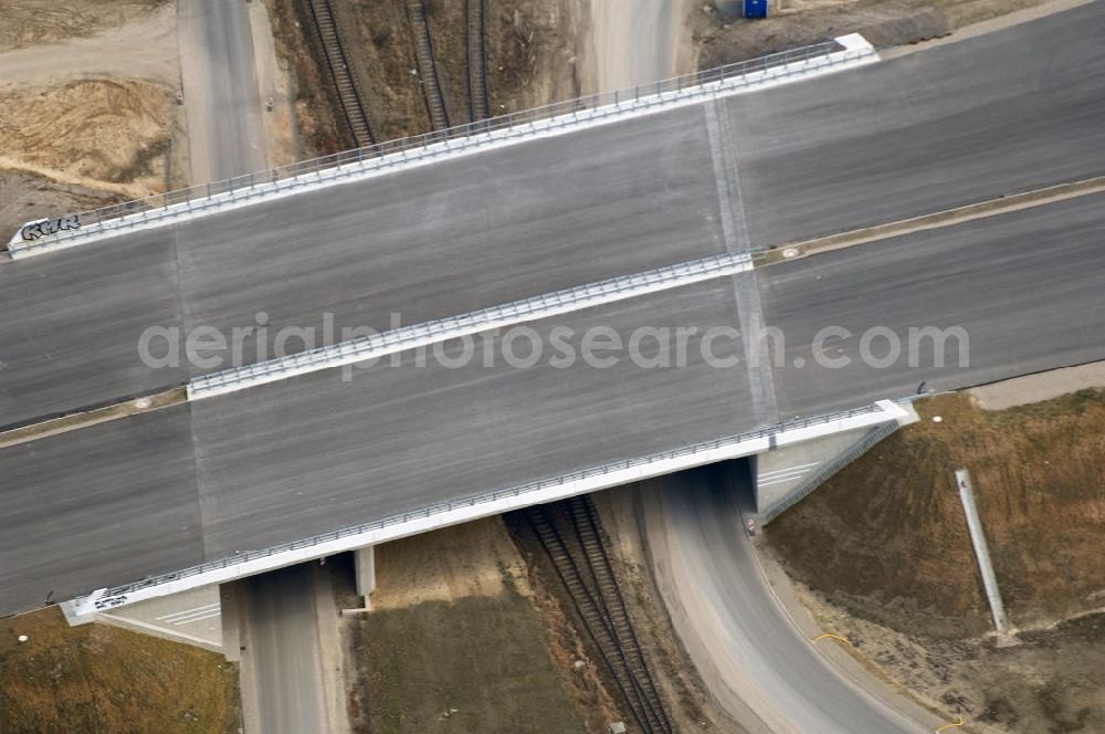 Aerial photograph Schönefeld - Blick auf den Ausbau der A113n als südöstliches Tor zur Hauptstadt. Unter Berücksichtigung des Flughafen Berlin Brandenburg International wurde eine Verkehrskonzeption für den Ausbau des Straßennetzes im Raum Berlin-Schönefeld erarbeitet, die zwei Stufen umfasste. Die erste Stufe sah den vierstreifigen Ausbau der Bundesstraßen B 96a und B 179 mit der Anbindung des Flughafens über zwei Knotenpunkte vor. Inhalt der zweiten Stufe war der Anschluß der Bundesautobahn A 113 neu an die B 9?????????????????????????????????????????????????????????????????