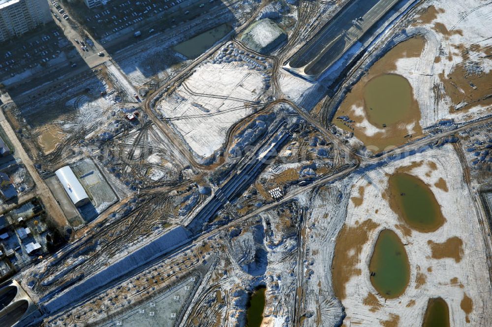 Aerial photograph Schönefeld - Blick auf den Ausbau der A113n als südöstliches Tor zur Hauptstadt. Unter Berücksichtigung des Flughafens Berlin Brandenburg International wurde eine Verkehrskonzeption für den Ausbau des Straßennetzes im Raum Berlin-Schönefeld erarbeitet, die zwei Stufen umfasste. Die erste Stufe sah den vierstreifigen Ausbau der Bundesstraßen B 96a und B 179 mit der Anbindung des Flughafens über zwei Knotenpunkte vor. Inhalt der zweiten Stufe war der Anschluß der Bundesautobahn A 113 neu an die B 96a und B 179. SCHÜßLER Plan Ingenieurgesellschaft, BATEG, EUROVIA