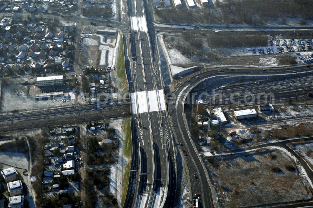 Schönefeld from the bird's eye view: Blick auf den Ausbau der A113n als südöstliches Tor zur Hauptstadt. Unter Berücksichtigung des Flughafens Berlin Brandenburg International wurde eine Verkehrskonzeption für den Ausbau des Straßennetzes im Raum Berlin-Schönefeld erarbeitet, die zwei Stufen umfasste. Die erste Stufe sah den vierstreifigen Ausbau der Bundesstraßen B 96a und B 179 mit der Anbindung des Flughafens über zwei Knotenpunkte vor. Inhalt der zweiten Stufe war der Anschluß der Bundesautobahn A 113 neu an die B 96a und B 179. SCHÜßLER Plan Ingenieurgesellschaft, BATEG, EUROVIA