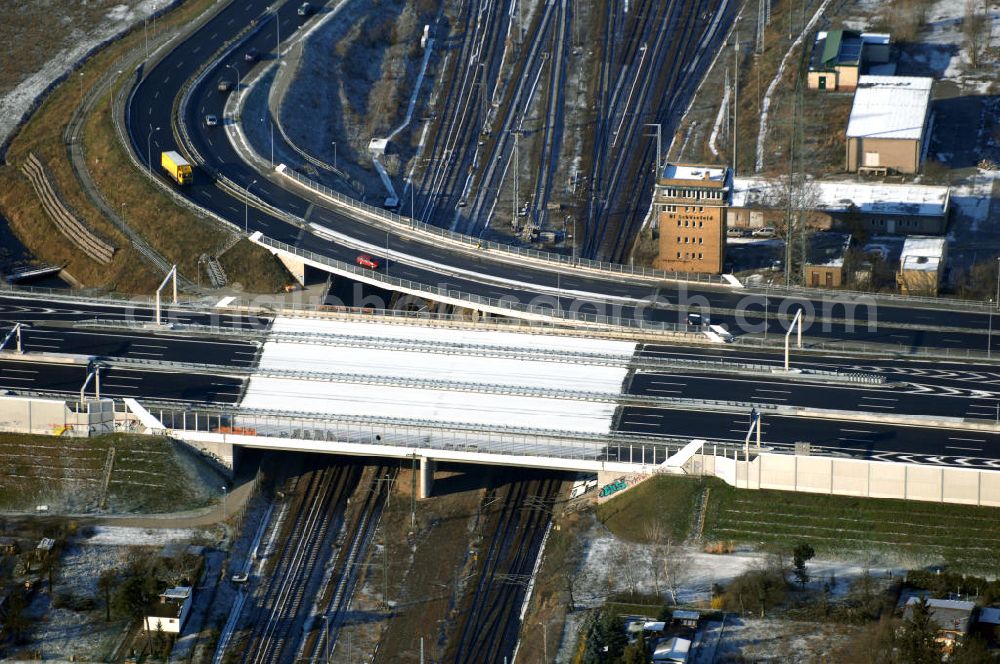 Schönefeld from the bird's eye view: Blick auf den Ausbau der A113n als südöstliches Tor zur Hauptstadt. Unter Berücksichtigung des Flughafens Berlin Brandenburg International wurde eine Verkehrskonzeption für den Ausbau des Straßennetzes im Raum Berlin-Schönefeld erarbeitet, die zwei Stufen umfasste. Die erste Stufe sah den vierstreifigen Ausbau der Bundesstraßen B 96a und B 179 mit der Anbindung des Flughafens über zwei Knotenpunkte vor. Inhalt der zweiten Stufe war der Anschluß der Bundesautobahn A 113 neu an die B 96a und B 179. SCHÜßLER Plan Ingenieurgesellschaft, BATEG, EUROVIA