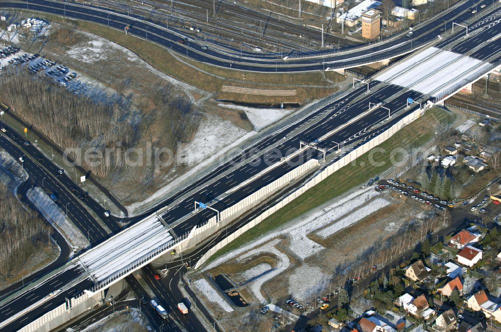 Aerial photograph Schönefeld - Blick auf den Ausbau der A113n als südöstliches Tor zur Hauptstadt. Unter Berücksichtigung des Flughafens Berlin Brandenburg International wurde eine Verkehrskonzeption für den Ausbau des Straßennetzes im Raum Berlin-Schönefeld erarbeitet, die zwei Stufen umfasste. Die erste Stufe sah den vierstreifigen Ausbau der Bundesstraßen B 96a und B 179 mit der Anbindung des Flughafens über zwei Knotenpunkte vor. Inhalt der zweiten Stufe war der Anschluß der Bundesautobahn A 113 neu an die B 96a und B 179. SCHÜßLER Plan Ingenieurgesellschaft, BATEG, EUROVIA