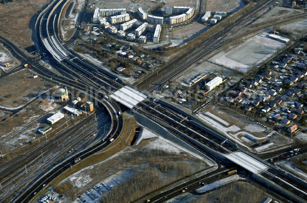 Schönefeld from the bird's eye view: Blick auf den Ausbau der A113n als südöstliches Tor zur Hauptstadt. Unter Berücksichtigung des Flughafens Berlin Brandenburg International wurde eine Verkehrskonzeption für den Ausbau des Straßennetzes im Raum Berlin-Schönefeld erarbeitet, die zwei Stufen umfasste. Die erste Stufe sah den vierstreifigen Ausbau der Bundesstraßen B 96a und B 179 mit der Anbindung des Flughafens über zwei Knotenpunkte vor. Inhalt der zweiten Stufe war der Anschluß der Bundesautobahn A 113 neu an die B 96a und B 179. SCHÜßLER Plan Ingenieurgesellschaft, BATEG, EUROVIA