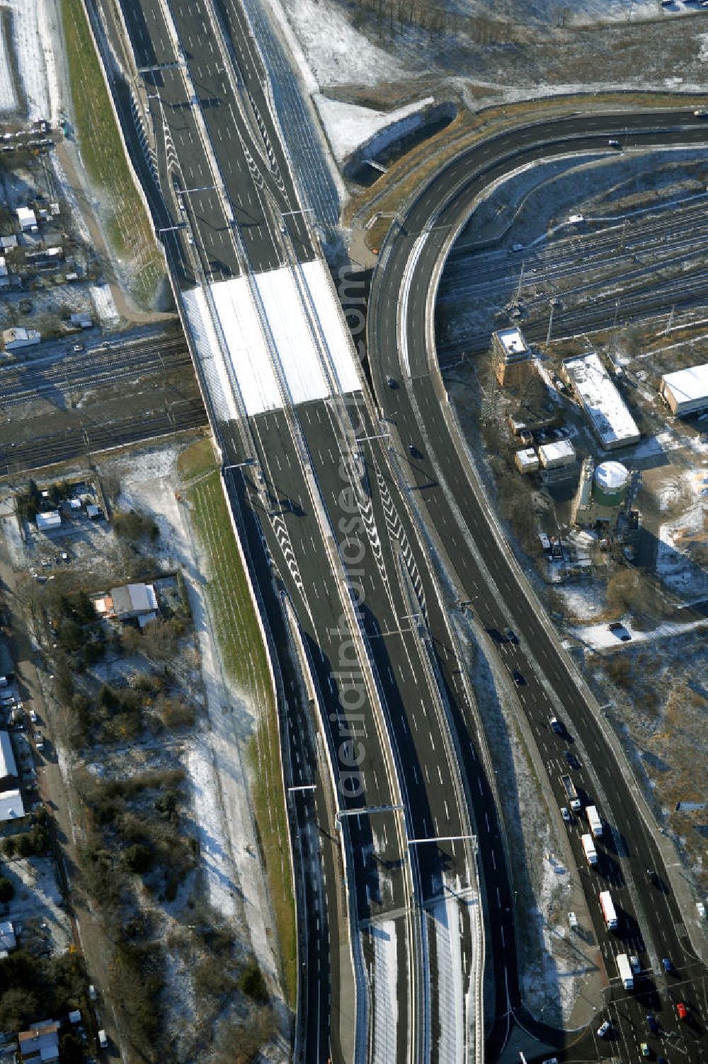 Schönefeld from the bird's eye view: Blick auf den Ausbau der A113n als südöstliches Tor zur Hauptstadt. Unter Berücksichtigung des Flughafens Berlin Brandenburg International wurde eine Verkehrskonzeption für den Ausbau des Straßennetzes im Raum Berlin-Schönefeld erarbeitet, die zwei Stufen umfasste. Die erste Stufe sah den vierstreifigen Ausbau der Bundesstraßen B 96a und B 179 mit der Anbindung des Flughafens über zwei Knotenpunkte vor. Inhalt der zweiten Stufe war der Anschluß der Bundesautobahn A 113 neu an die B 96a und B 179. SCHÜßLER Plan Ingenieurgesellschaft, BATEG, EUROVIA