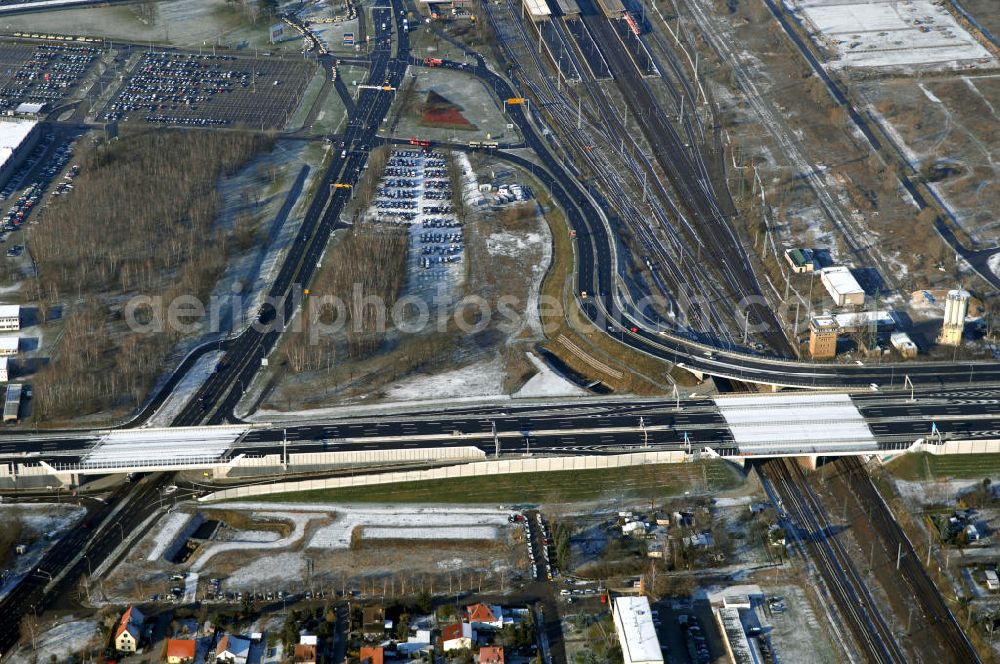 Aerial photograph Schönefeld - Blick auf den Ausbau der A113n als südöstliches Tor zur Hauptstadt. Unter Berücksichtigung des Flughafens Berlin Brandenburg International wurde eine Verkehrskonzeption für den Ausbau des Straßennetzes im Raum Berlin-Schönefeld erarbeitet, die zwei Stufen umfasste. Die erste Stufe sah den vierstreifigen Ausbau der Bundesstraßen B 96a und B 179 mit der Anbindung des Flughafens über zwei Knotenpunkte vor. Inhalt der zweiten Stufe war der Anschluß der Bundesautobahn A 113 neu an die B 96a und B 179. SCHÜßLER Plan Ingenieurgesellschaft, BATEG, EUROVIA