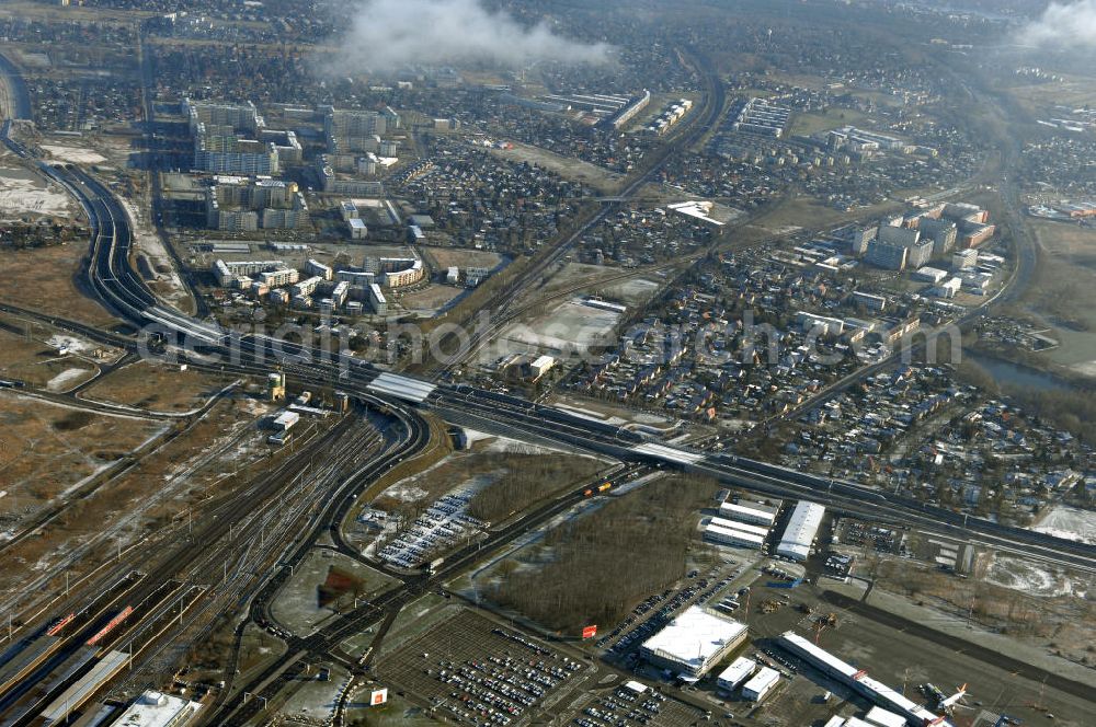 Aerial photograph Schönefeld - Blick auf den Ausbau der A113n als südöstliches Tor zur Hauptstadt. Unter Berücksichtigung des Flughafens Berlin Brandenburg International wurde eine Verkehrskonzeption für den Ausbau des Straßennetzes im Raum Berlin-Schönefeld erarbeitet, die zwei Stufen umfasste. Die erste Stufe sah den vierstreifigen Ausbau der Bundesstraßen B 96a und B 179 mit der Anbindung des Flughafens über zwei Knotenpunkte vor. Inhalt der zweiten Stufe war der Anschluß der Bundesautobahn A 113 neu an die B 96a und B 179. SCHÜßLER Plan Ingenieurgesellschaft, BATEG, EUROVIA