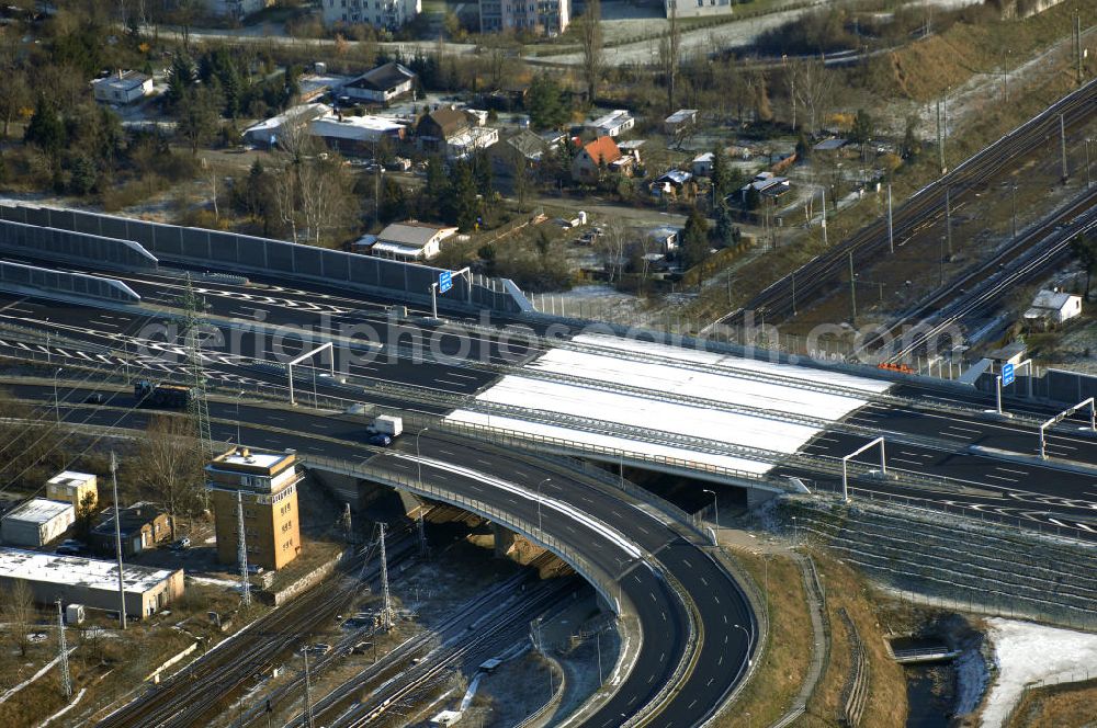 Aerial image Schönefeld - Blick auf den Ausbau der A113n als südöstliches Tor zur Hauptstadt. Unter Berücksichtigung des Flughafens Berlin Brandenburg International wurde eine Verkehrskonzeption für den Ausbau des Straßennetzes im Raum Berlin-Schönefeld erarbeitet, die zwei Stufen umfasste. Die erste Stufe sah den vierstreifigen Ausbau der Bundesstraßen B 96a und B 179 mit der Anbindung des Flughafens über zwei Knotenpunkte vor. Inhalt der zweiten Stufe war der Anschluß der Bundesautobahn A 113 neu an die B 96a und B 179. SCHÜßLER Plan Ingenieurgesellschaft, BATEG, EUROVIA