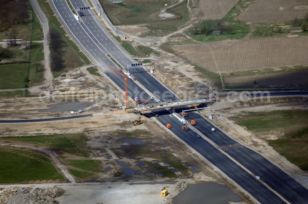 Schönefeld from the bird's eye view: Blick auf den Bereich der Stadtautobahn / Zubringer A113n als südöstliches Tor zur Hauptstadt kurz vor der Verkehrsfreigabe. Unter Berücksichtigung des Flughafens Berlin Brandenburg International wurde eine Verkehrskonzeption für den Ausbau des Straßennetzes im Raum Berlin-Schönefeld erarbeitet, die zwei Stufen umfasste. Die erste Stufe sah den vierstreifigen Ausbau der Bundesstraßen B 96a und B 179 mit der Anbindung des Flughafens über zwei Knotenpunkte vor. Inhalt der zweiten Stufe war der Anschluß der Bundesautobahn A 113 neu an die B 96a und B 179. SCHÜßLER Plan Ingenieurgesellschaft, BATEG, EUROVIA, BERGER