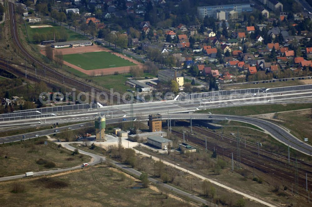 Schönefeld from the bird's eye view: Blick auf den Bereich der Stadtautobahn / Zubringer A113n als südöstliches Tor zur Hauptstadt kurz vor der Verkehrsfreigabe. Unter Berücksichtigung des Flughafens Berlin Brandenburg International wurde eine Verkehrskonzeption für den Ausbau des Straßennetzes im Raum Berlin-Schönefeld erarbeitet, die zwei Stufen umfasste. Die erste Stufe sah den vierstreifigen Ausbau der Bundesstraßen B 96a und B 179 mit der Anbindung des Flughafens über zwei Knotenpunkte vor. Inhalt der zweiten Stufe war der Anschluß der Bundesautobahn A 113 neu an die B 96a und B 179. SCHÜßLER Plan Ingenieurgesellschaft, BATEG, EUROVIA, BERGER