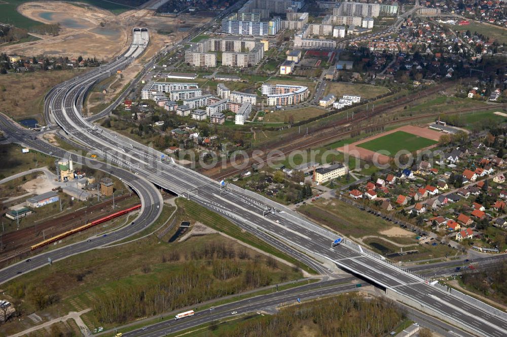 Schönefeld from the bird's eye view: Blick auf den Bereich der Stadtautobahn / Zubringer A113n als südöstliches Tor zur Hauptstadt kurz vor der Verkehrsfreigabe. Unter Berücksichtigung des Flughafens Berlin Brandenburg International wurde eine Verkehrskonzeption für den Ausbau des Straßennetzes im Raum Berlin-Schönefeld erarbeitet, die zwei Stufen umfasste. Die erste Stufe sah den vierstreifigen Ausbau der Bundesstraßen B 96a und B 179 mit der Anbindung des Flughafens über zwei Knotenpunkte vor. Inhalt der zweiten Stufe war der Anschluß der Bundesautobahn A 113 neu an die B 96a und B 179. SCHÜßLER Plan Ingenieurgesellschaft, BATEG, EUROVIA, BERGER