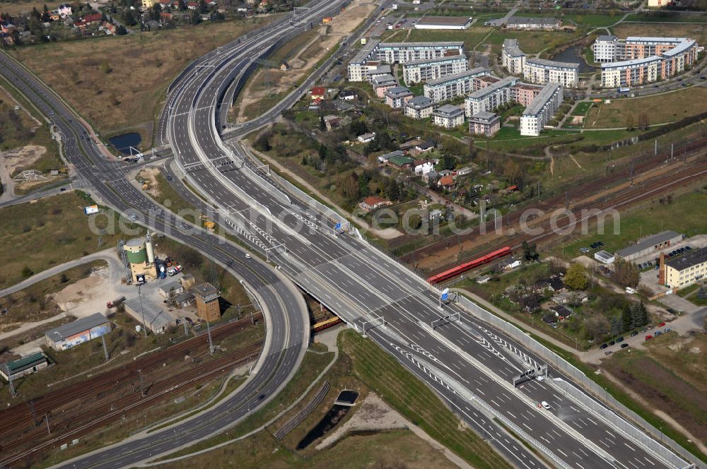 Schönefeld from the bird's eye view: Blick auf den Bereich der Stadtautobahn / Zubringer A113n als südöstliches Tor zur Hauptstadt kurz vor der Verkehrsfreigabe. Unter Berücksichtigung des Flughafens Berlin Brandenburg International wurde eine Verkehrskonzeption für den Ausbau des Straßennetzes im Raum Berlin-Schönefeld erarbeitet, die zwei Stufen umfasste. Die erste Stufe sah den vierstreifigen Ausbau der Bundesstraßen B 96a und B 179 mit der Anbindung des Flughafens über zwei Knotenpunkte vor. Inhalt der zweiten Stufe war der Anschluß der Bundesautobahn A 113 neu an die B 96a und B 179. SCHÜßLER Plan Ingenieurgesellschaft, BATEG, EUROVIA, BERGER