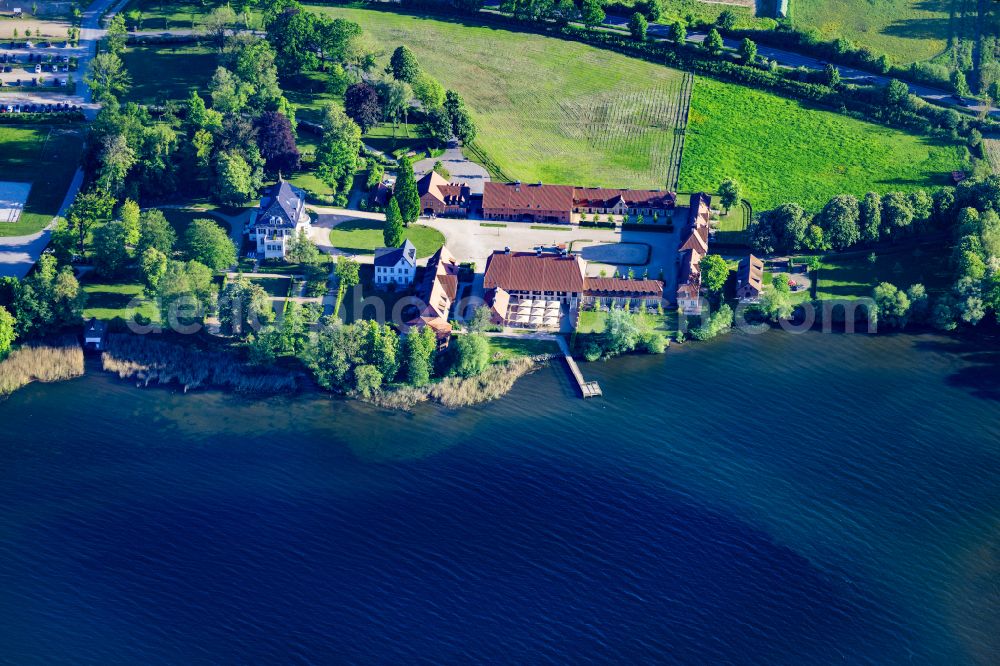 Malente from above - Construction sites for redevelopment, renovation to expansion of the buildings and manor house of the estate Gut Immenhof on the banks of the Kellersee in Malente in the state Schleswig-Holstein, Germany