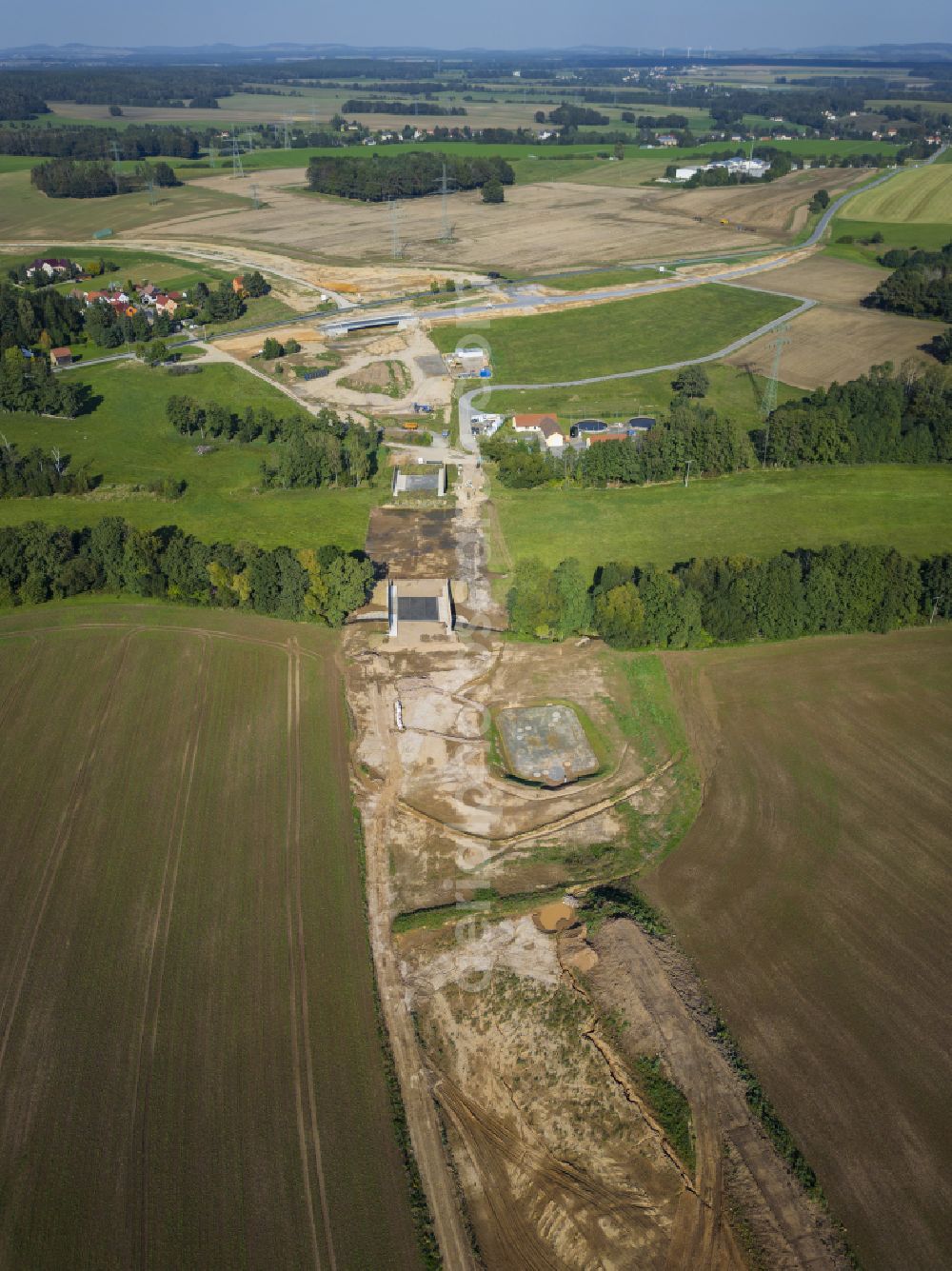 Eschdorf from the bird's eye view: Construction of the bypass road in on street Pirnaer Strasse in Eschdorf in the state Saxony, Germany