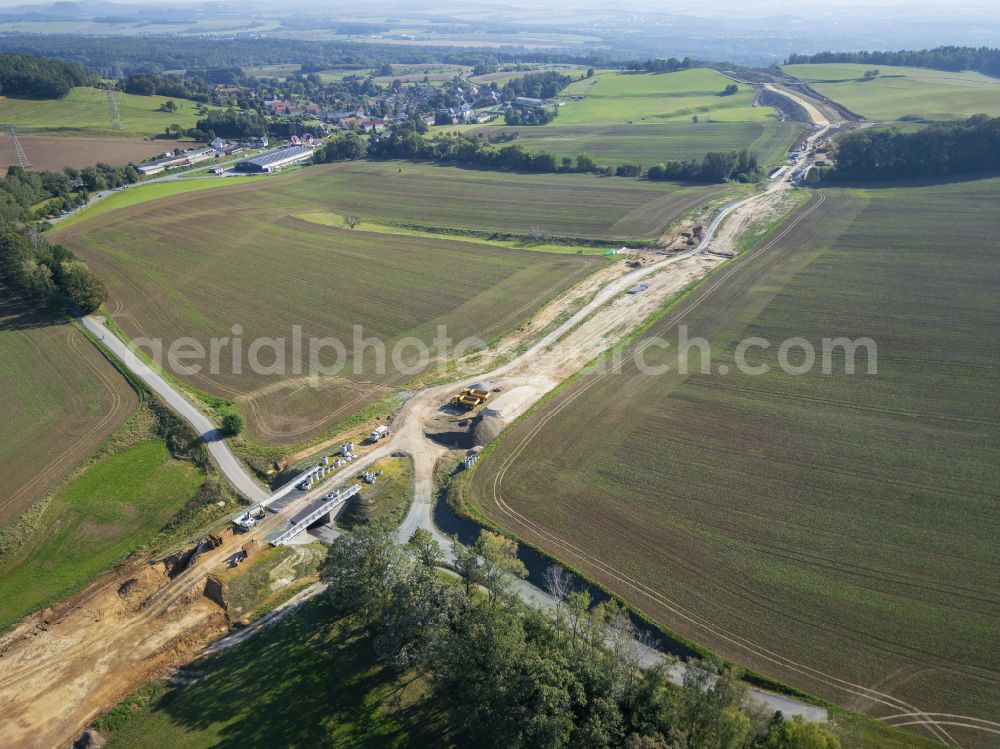 Eschdorf from the bird's eye view: Construction of the bypass road in on street Pirnaer Strasse in Eschdorf in the state Saxony, Germany