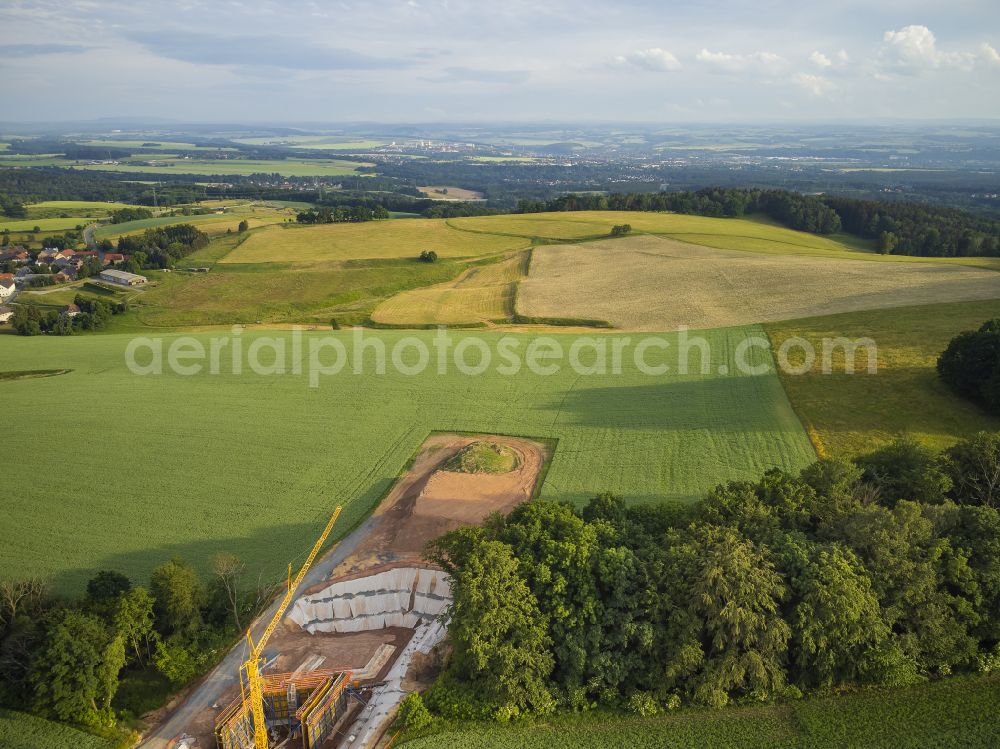 Eschdorf from the bird's eye view: Construction of the bypass road in on street Pirnaer Strasse in Eschdorf in the state Saxony, Germany