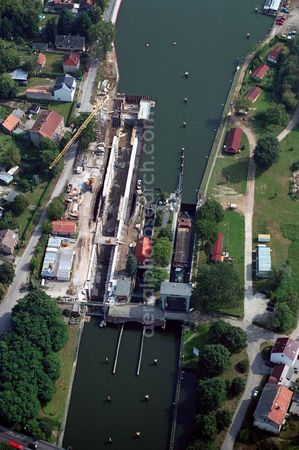 Aerial photograph Wernsdorf (Brandenburg) - Blick auf den Ausbau und die Instandsetzungsarbeiten der Wernsdorfer Schleuse. Die Schleuse ist eine von 4 Schleusen des Oder-Spree-Kanals. Beteiligtes Bauunternehmer u.a Heinrich Hecker GmbH & Co. KG. Vorr. Fertigstellung: Mai 2006 Bauherr: Wasser- und Schifffahrtsamt Berlin, Mehringdamm 129, 10965 Berlin, Tel. 030 / 69532 - 0, Fax: 030 / 69532 - 201, e-mail-Adresse: poststelle@wsa-b.wsv.de, Achim Walder-Adresse: