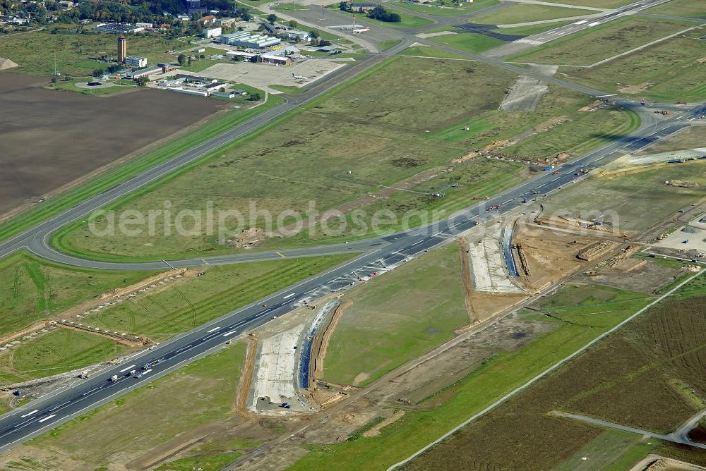 Aerial image Schönefeld - Ausbau der Start- und Landebahn auf dem Flughafen Berlin Schönefeld. Zur bestehenden Rollbahn werden durch die Firmen TRAPP und PAPENBURG zusätzliche An- und Abrollwege errichtet. To the existing runway will be built by the company and TRAPP PAPENBURG additional high-speed taxiways.