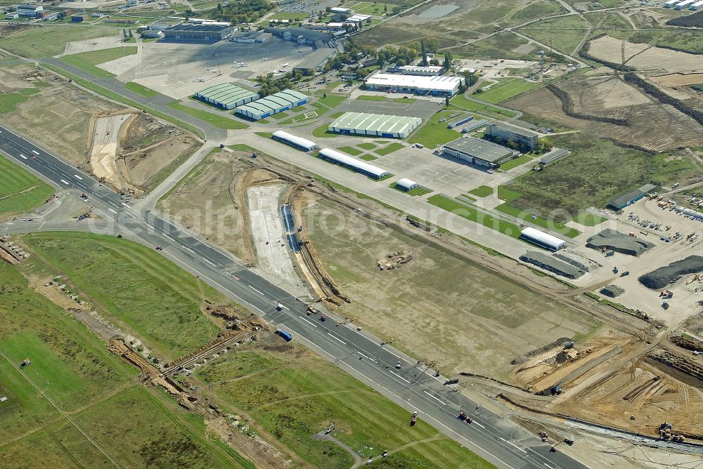 Schönefeld from the bird's eye view: Ausbau der Start- und Landebahn auf dem Flughafen Berlin Schönefeld. Zur bestehenden Rollbahn werden durch die Firmen TRAPP und PAPENBURG zusätzliche An- und Abrollwege errichtet. To the existing runway will be built by the company and TRAPP PAPENBURG additional high-speed taxiways.