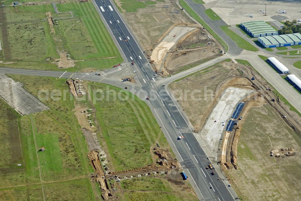 Aerial image Schönefeld - Ausbau der Start- und Landebahn auf dem Flughafen Berlin Schönefeld. Zur bestehenden Rollbahn werden durch die Firmen TRAPP und PAPENBURG zusätzliche An- und Abrollwege errichtet. To the existing runway will be built by the company and TRAPP PAPENBURG additional high-speed taxiways.