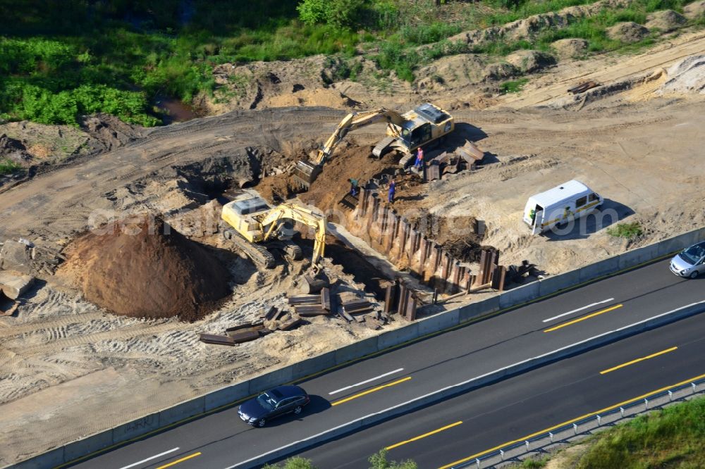 Rauen from the bird's eye view: Construction and widening of the route of the highway / motorway BAB A12 / E30 at Rauen in Brandenburg