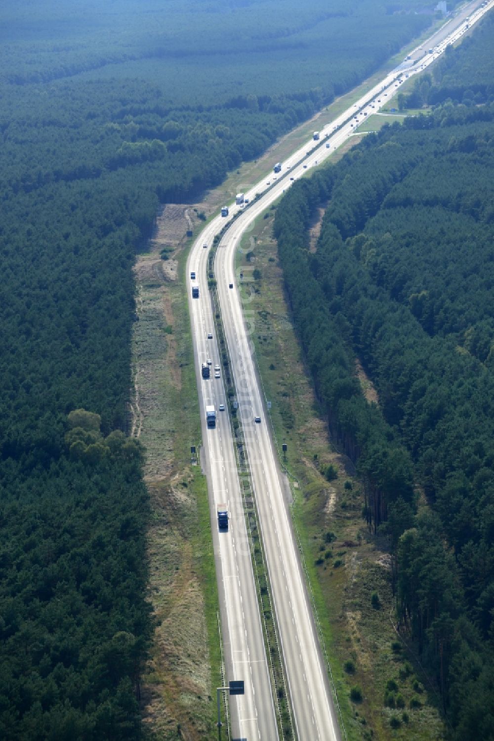 Aerial image Spreenhagen - View expansion and widening of the route of the highway / motorway BAB A12 / E30 Spreenhagen in the state of Brandenburg. The picture shows a concrete paver contractor eurovia in the production of the new road surface