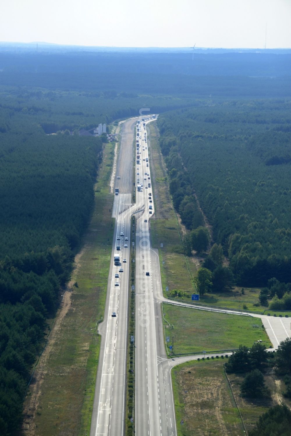 Aerial photograph Spreenhagen - View expansion and widening of the route of the highway / motorway BAB A12 / E30 Spreenhagen in the state of Brandenburg. The picture shows a concrete paver contractor eurovia in the production of the new road surface