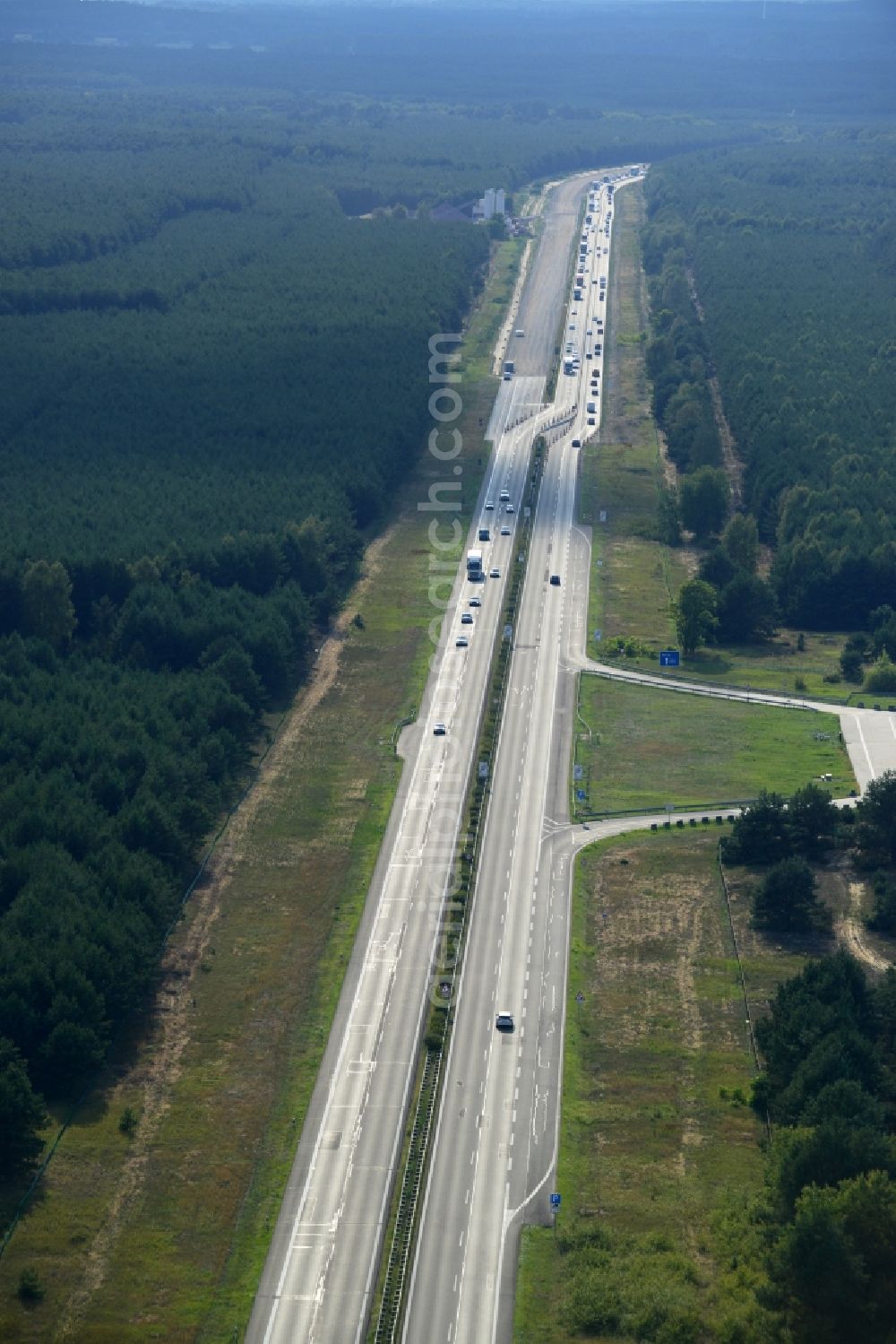 Spreenhagen from above - View expansion and widening of the route of the highway / motorway BAB A12 / E30 Spreenhagen in the state of Brandenburg. The picture shows a concrete paver contractor eurovia in the production of the new road surface