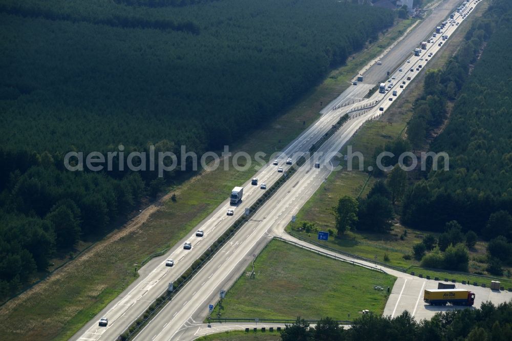 Spreenhagen from the bird's eye view: View expansion and widening of the route of the highway / motorway BAB A12 / E30 Spreenhagen in the state of Brandenburg. The picture shows a concrete paver contractor eurovia in the production of the new road surface