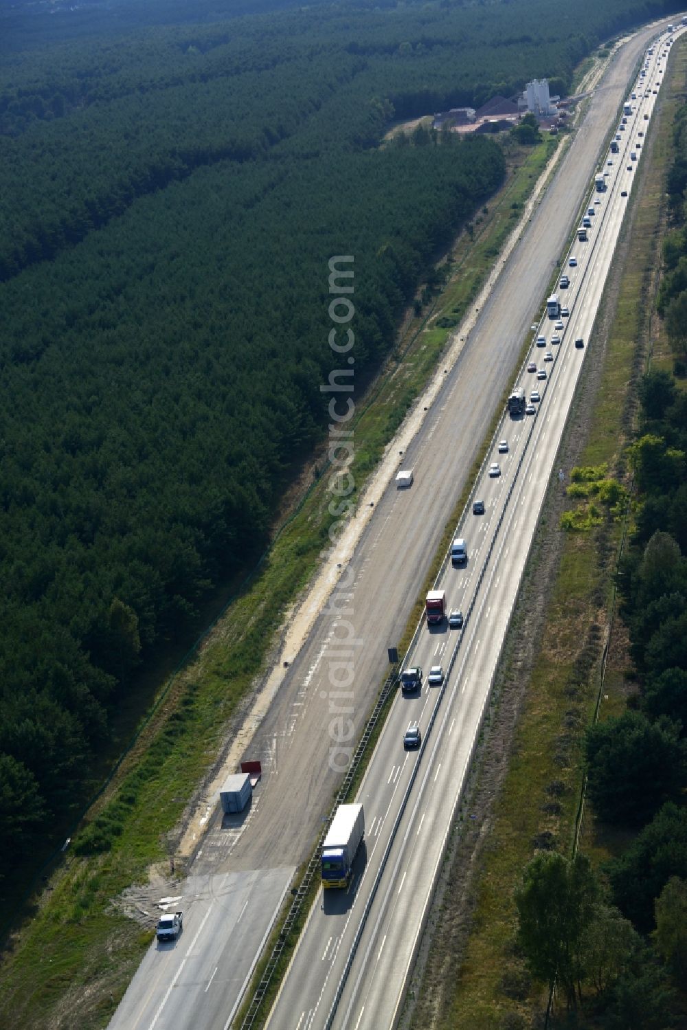 Aerial photograph Spreenhagen - View expansion and widening of the route of the highway / motorway BAB A12 / E30 Spreenhagen in the state of Brandenburg. The picture shows a concrete paver contractor eurovia in the production of the new road surface