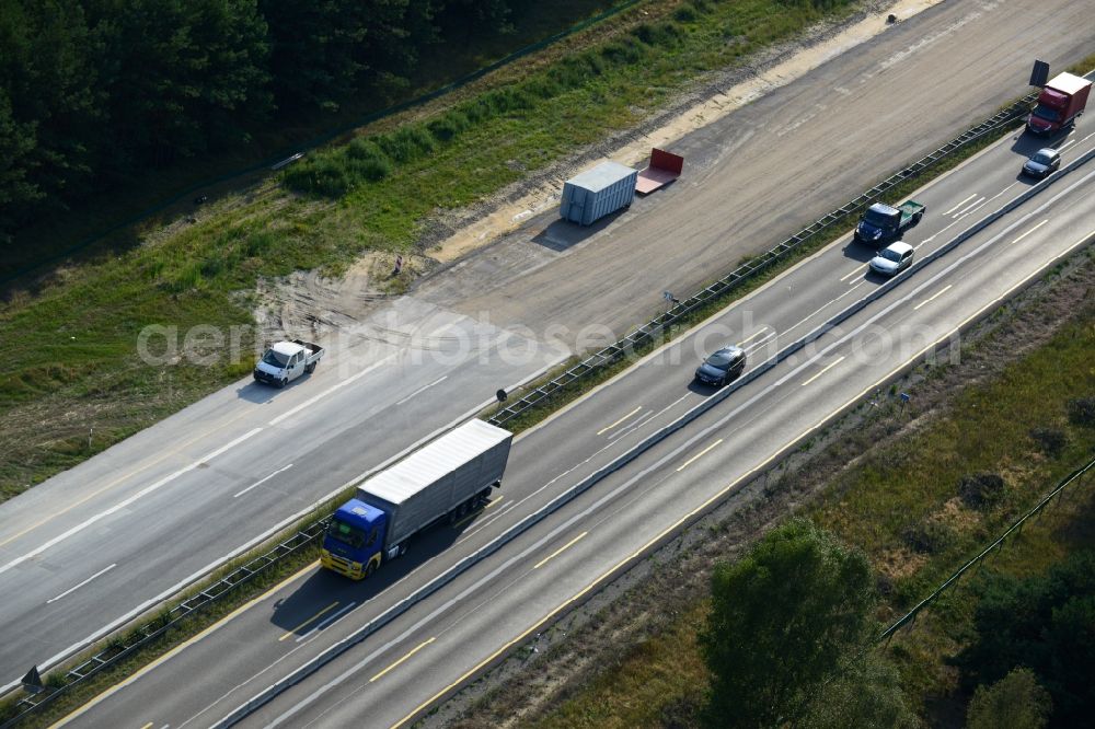 Spreenhagen from above - View expansion and widening of the route of the highway / motorway BAB A12 / E30 Spreenhagen in the state of Brandenburg. The picture shows a concrete paver contractor eurovia in the production of the new road surface