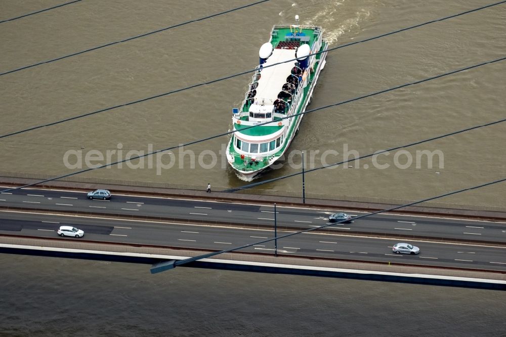 Düsseldorf from above - Passenger and tourist ship Loreley of Koeln-Duesseldorfer Deutsche Rheinschifffahrt AG at the Oberkasseler Bruecke bridge in Duesseldorf in the state of North Rhine-Westphalia