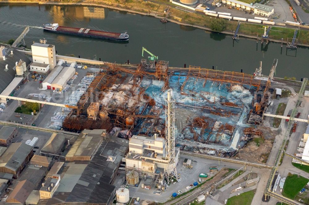 Aerial image Krefeld - View at a burned-out storage hall on the site of the fertilizer producer COMPO GmbH & Co.KG in the Rhine harbor in the district Uerdingen in Krefeld in the federal state North Rhine-Westphalia. During the fire, according to the company Compo, about 33 thousand tons of chemicals are burned. Operator of the port is the port Krefeld GmbH & Co. KG